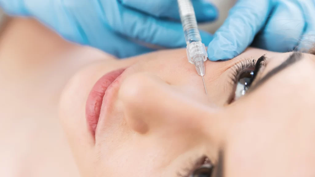 Image of injection of filler into woman eyebags
