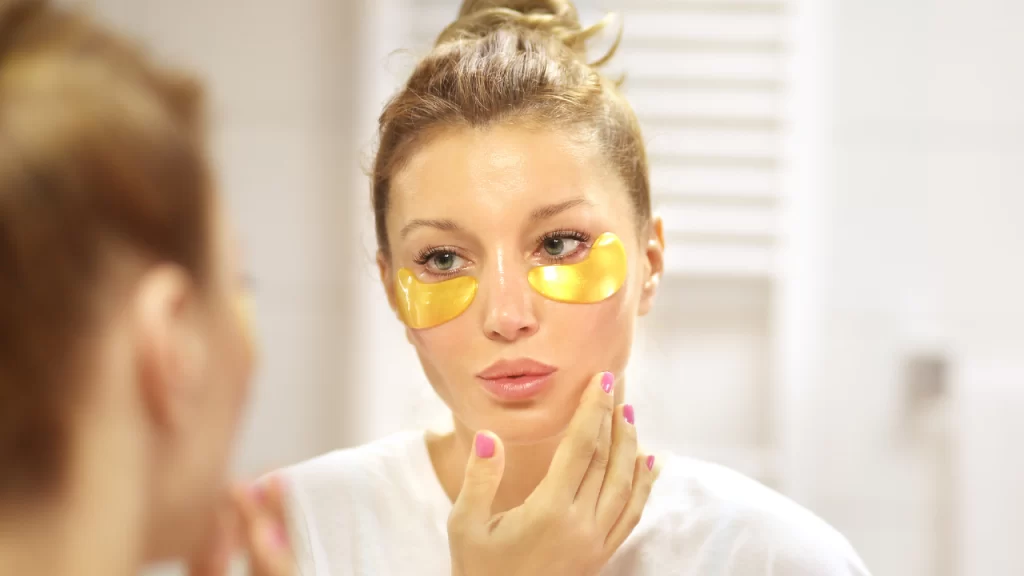 Image of woman applying eye mask