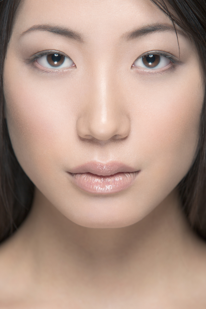 Woman with symmetrical nose after rhinoplasty singapore